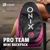 Pink and black backpack with 'ONIX' branding on a blurred background