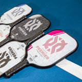 ONIX Evoke Premier Pickleball Paddle, lifestyle photo, line up of all the colors of the paddle