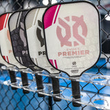 ONIX Evoke Premier Pickleball Paddle, lifestyle photo, line up of all the colors of the paddle