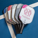 ONIX Evoke Premier Pickleball Paddle, lifestyle photo, line up of all the colors of the paddle