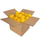 Cardboard box filled with yellow balls on a white background