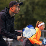 ONIX Composite Evoke Pro Pickleball Paddle, lifestyle photo, person holding paddle in a ready stance