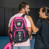 ONIX Pink Pro Team Backpack Pickleball Bag on guys back