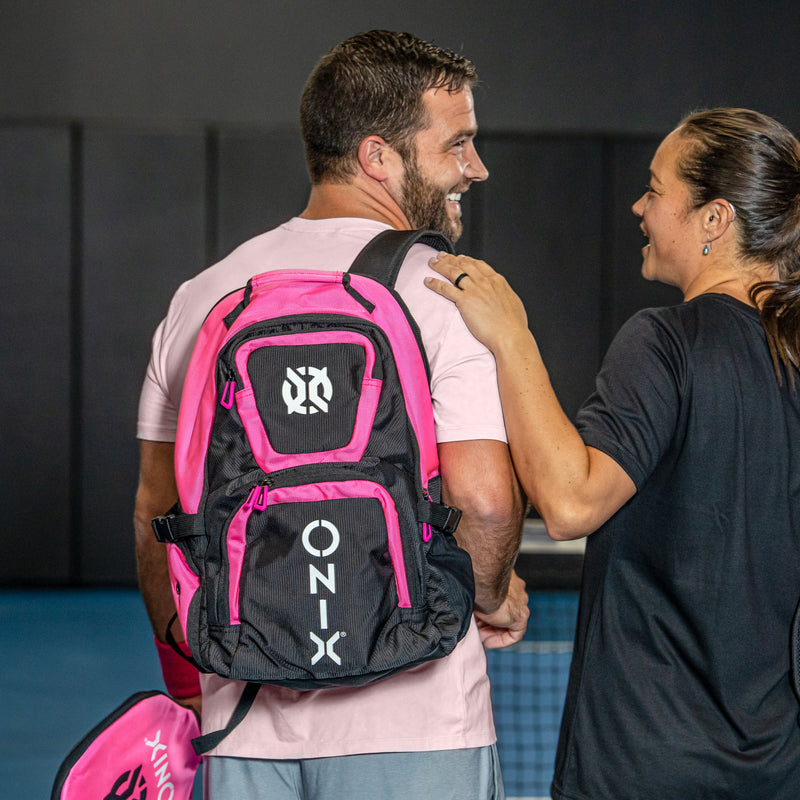 ONIX Pink Pro Team Backpack Pickleball Bag on guys back